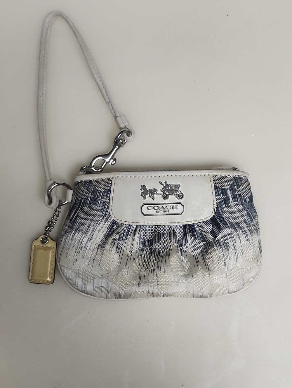 Coach: Cream & Black Hombre Patterned Wristlet- flaws